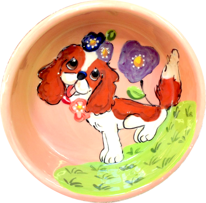 Sweet King Charles Blenheim sitting in flowers dog bowl
