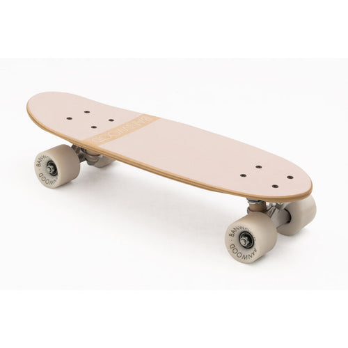 A classic-style pink Banwood cruiser skateboard with a Canadian maple deck and white high-rebound wheels.