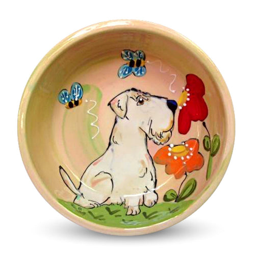 Hand-painted ceramic bowl featuring a Sealyham Terrier, colorful flowers, and bees, by Debby Carman, food safe, microwave and dishwasher safe, perfect for a pet's garden-themed meal, available at FauxPaw.com