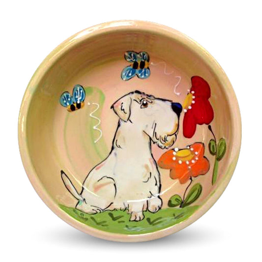 Hand-painted ceramic bowl featuring a Sealyham Terrier, colorful flowers, and bees, by Debby Carman, food safe, microwave and dishwasher safe, perfect for a pet's garden-themed meal, available at FauxPaw.com