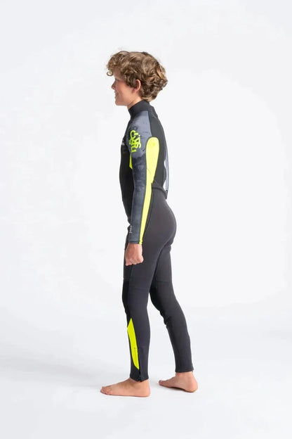 C-Skins Element 3/2 Junior wetsuit in black and yellow, side view on a child model