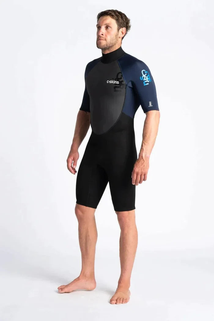 C-Skins Mens Element Shorty 3/2mm SS wetsuit, short sleeves, black and navy, model standing