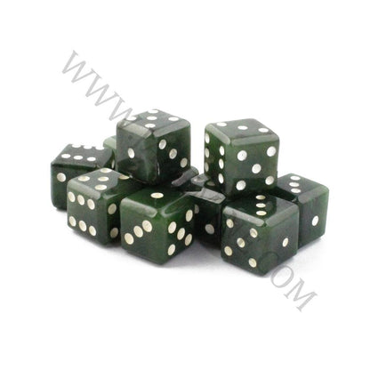 Cluster of green jade dice with white pips on a white background