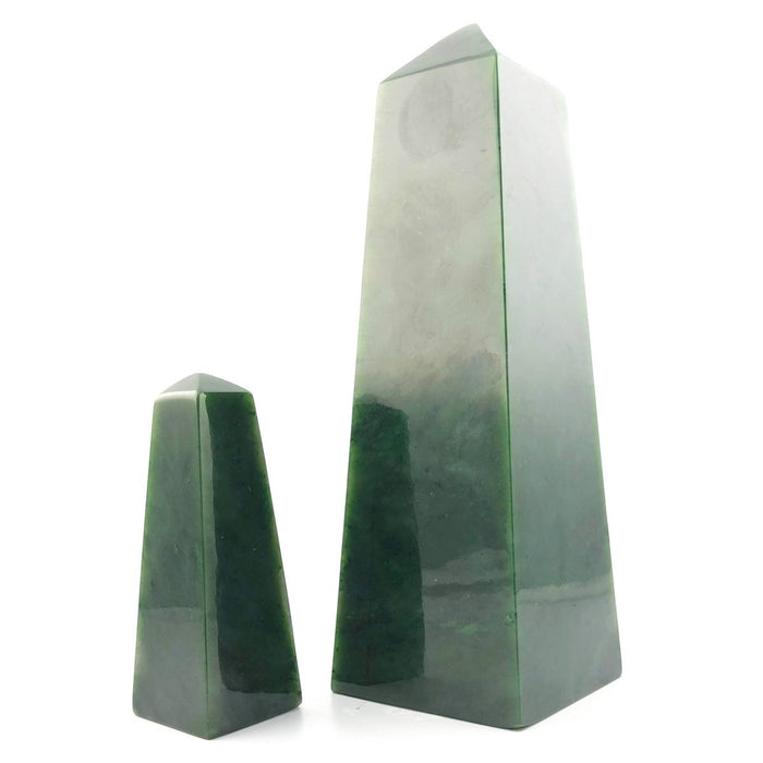 Tall and short Canadian jade obelisks side by side on a white background