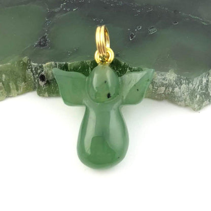 Green jade angel pendant with a gold loop bail.