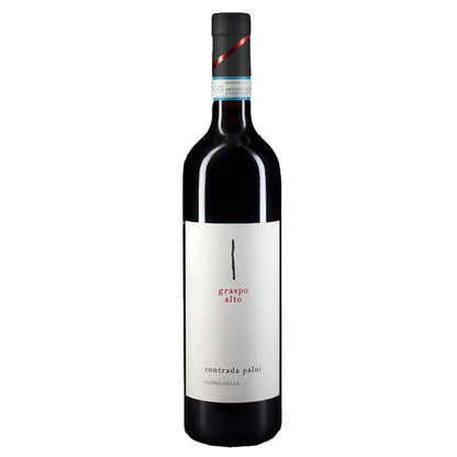 Wine bottle with dark glass and front label, red and blue foil on neck