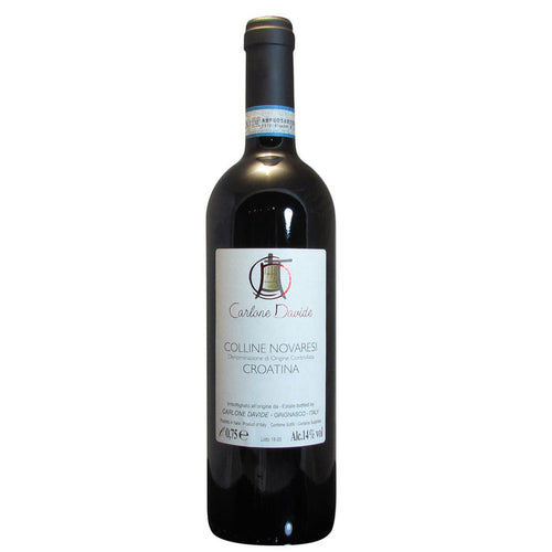 Dark glass wine bottle with white label and crest, red wine