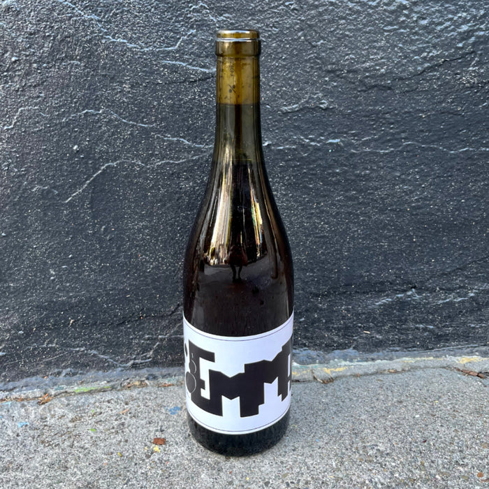 White wine bottle with gold foil cap and dark label