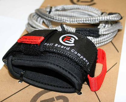 Foil Board Company black and red wing foil leash with coiled cord, watersports gear