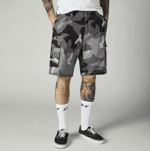 Gray camouflage cargo shorts with side pockets, paired with white socks and black sneakers.