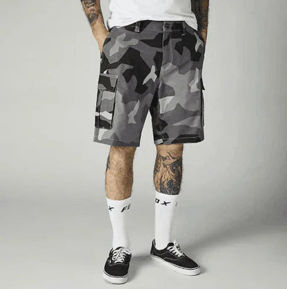 Gray camouflage cargo shorts with side pockets, paired with white socks and black sneakers.