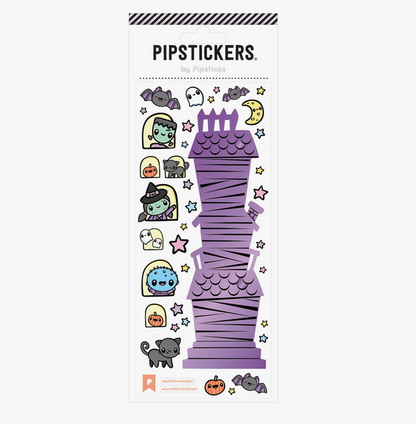 A sheet of PipStickers with various designs including a haunted house, ghosts, and stars on a purple background.
