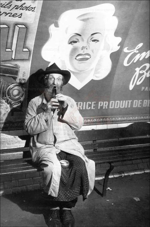 Homeless man playing music in the French Metro - VINTAGEARTREPRINTS.COM