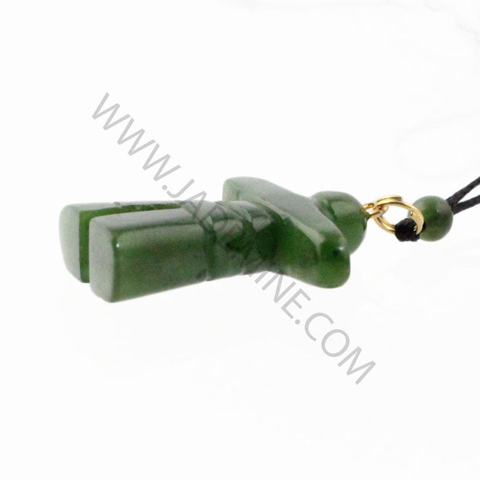 Side view of green jade Inukshuk pendant showing stacked stone segments and gold connector on the cord