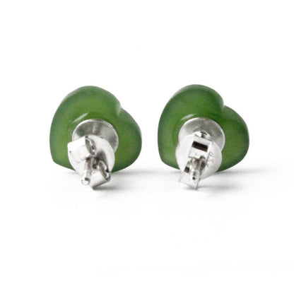 Two green jade heart stud earrings shown from a side angle with posts visible