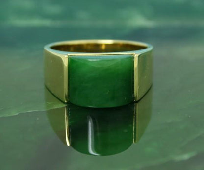 Green Jade Ring set in vermeil on a jade surface