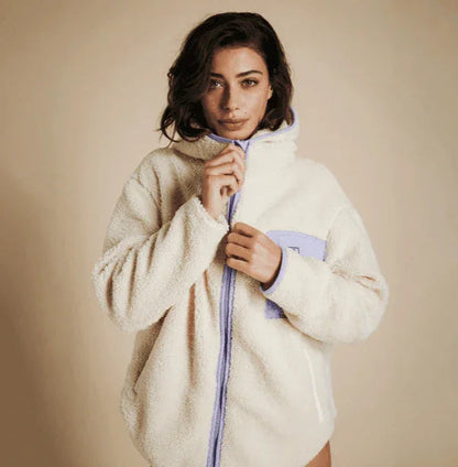 Mystic Dream Fleece Off White jacket with lavender zip and pocket, worn by woman