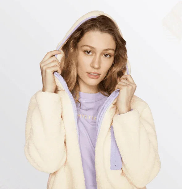 Woman wearing Mystic Dream Fleece Off-White hoodie with lilac lining, front view