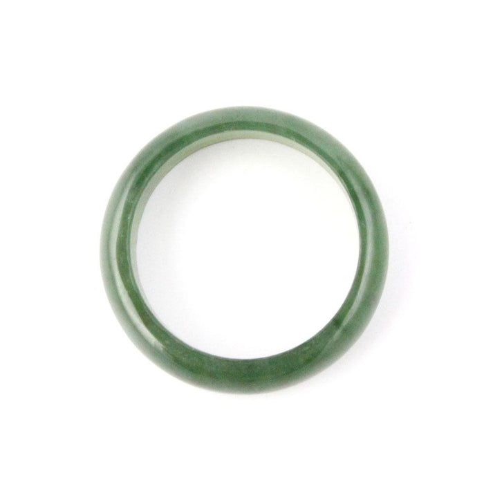 Close up of a narrow jade green band ring 5mm on a white background