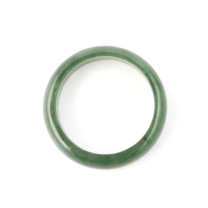 Close up of a narrow jade green band ring 5mm on a white background