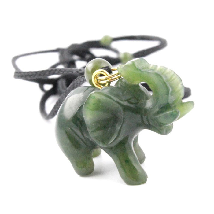 Jade green elephant pendant with a gold loop on a black cord necklace