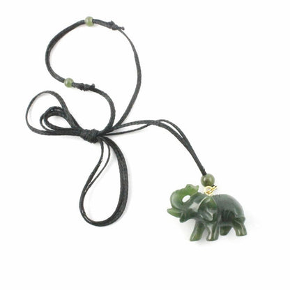 Green jade elephant pendant on a black cord necklace with green bead accents
