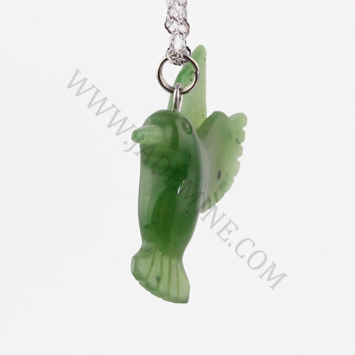 Side view of green jade hummingbird pendant on a silver chain