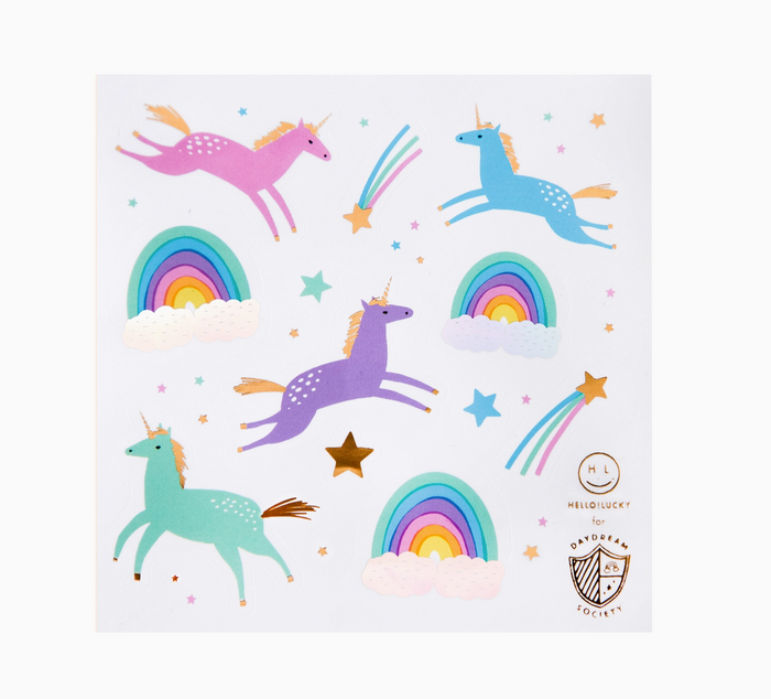 Colorful unicorn and rainbow stickers on a white background