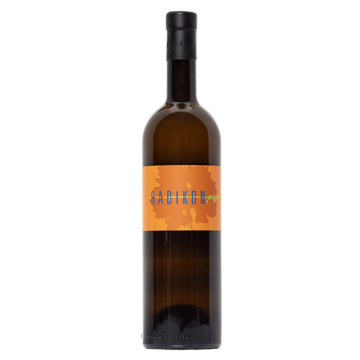 Radikon Pop Bianco wine bottle, orange label on dark glass with black cap.