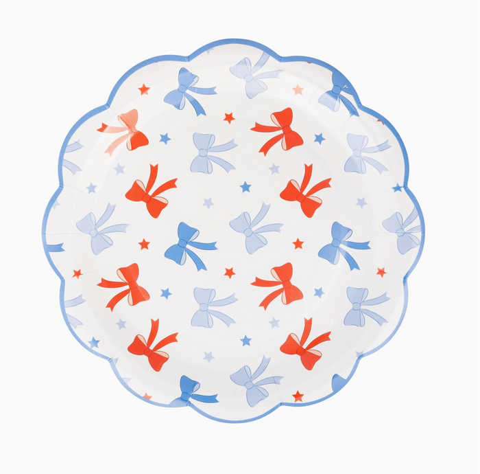 Decorative plate with red, blue, and orange bows on a white background
