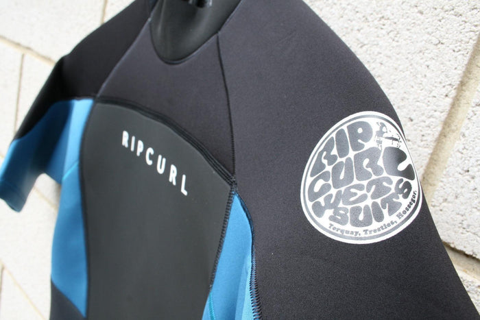 Rip Curl black and blue wetsuit with logo patch, ideal for watersports in Whitstable, Kent