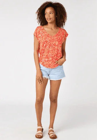 Rip Curl Sun Rays Reverse Ladies Tee red, short sleeve floral shirt worn by woman
