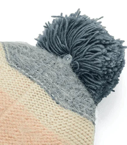 Gray pom-pom beanie with striped knit pattern, ideal for watersports and beachwear
