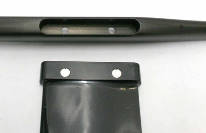 Black carbon fiber wing foil component with sleek design and mounting screws