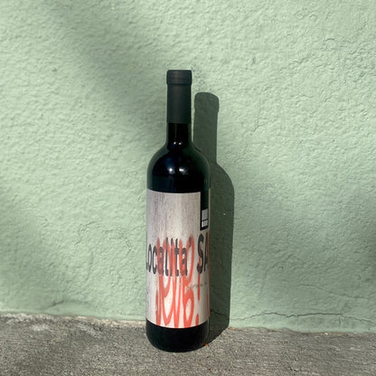 Santuvario red wine bottle, dark glass with cream and red label