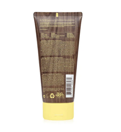 Sun Bum sunscreen lotion tube with yellow cap, brown label, and barcode visible