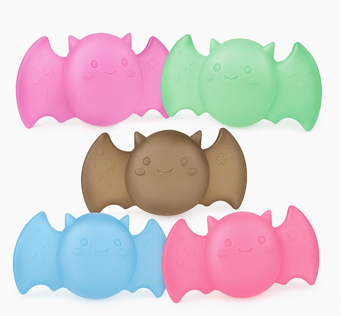 Set of colorful bat-shaped objects on a white background