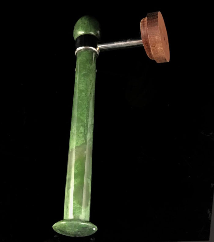 Green marble toilet paper holder stem with round wooden end cap and metal connector.