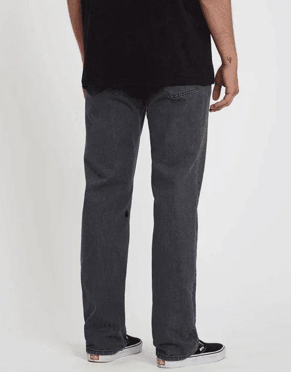 Vans black denim jeans, straight fit, back view, paired with Vans sneakers