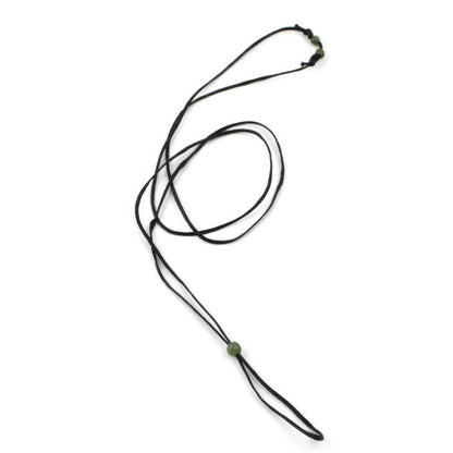 Waxed black cord necklace featuring a green jade bead at the end and small green beads at the top.