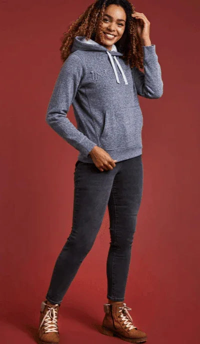 Grey hoodie with white drawstrings, paired with dark jeans and brown boots