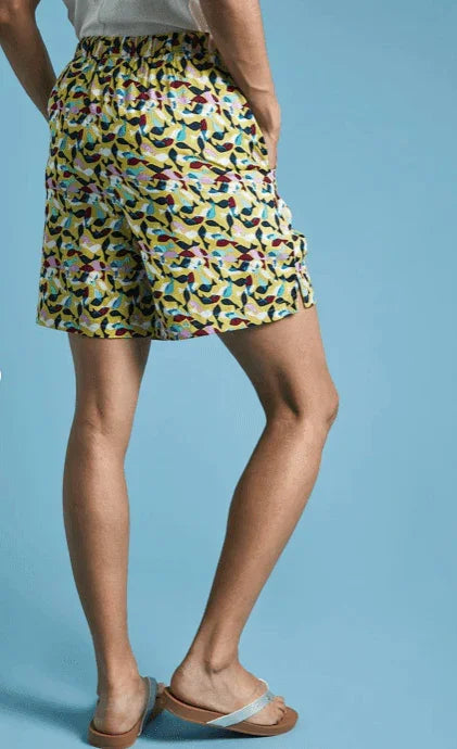 Yellow patterned surf shorts with colorful design, ideal for watersports in Whitstable, Kent